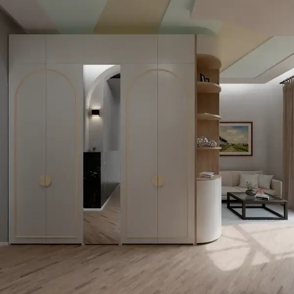 White wardrobe with arched door panels and round handles in a living room