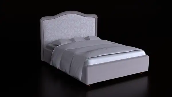 Grey upholstered bed with a shaped headboard on a dark studio background