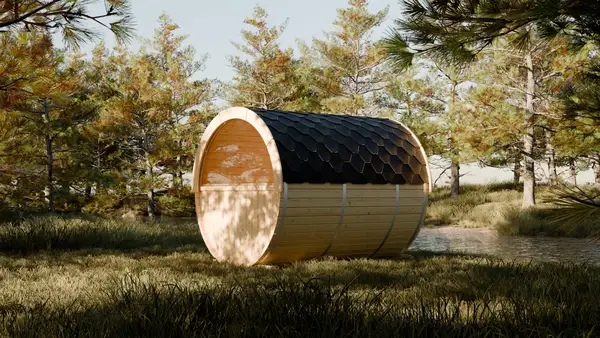Barrel sauna with dark roof in a pine forest clearing