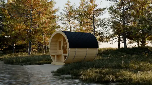 Barrel sauna by a lake at golden hour